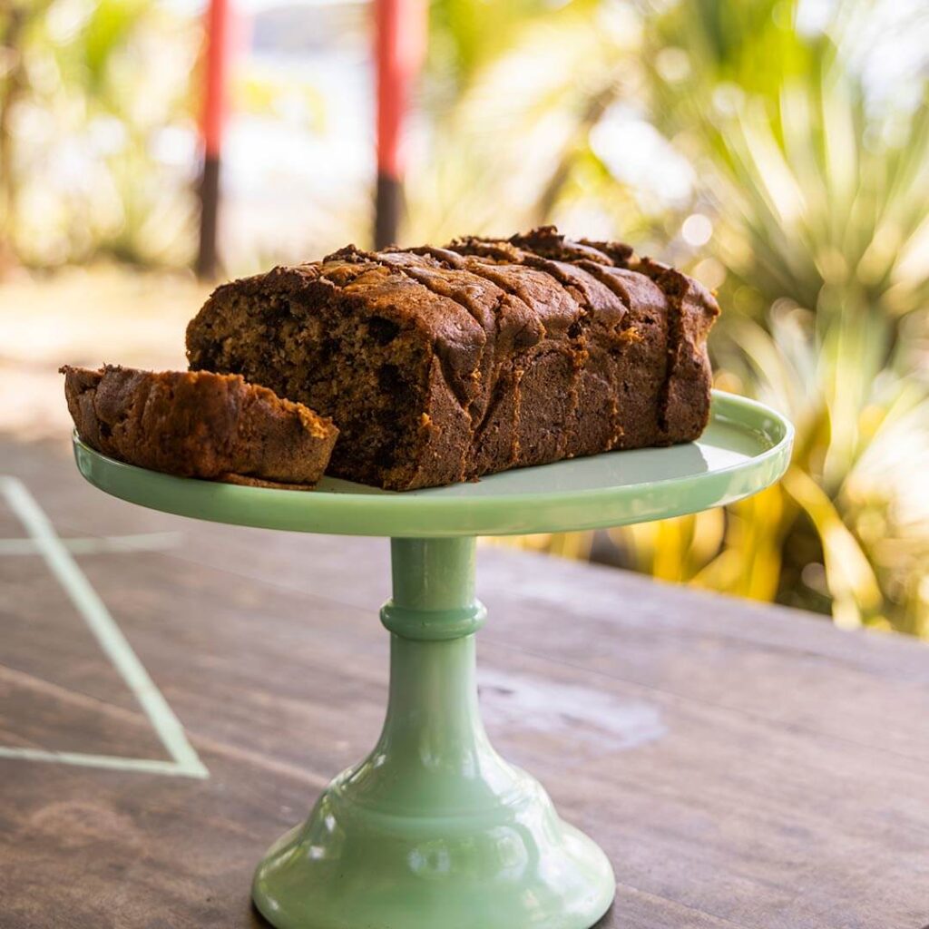 A brownie cake on a stand